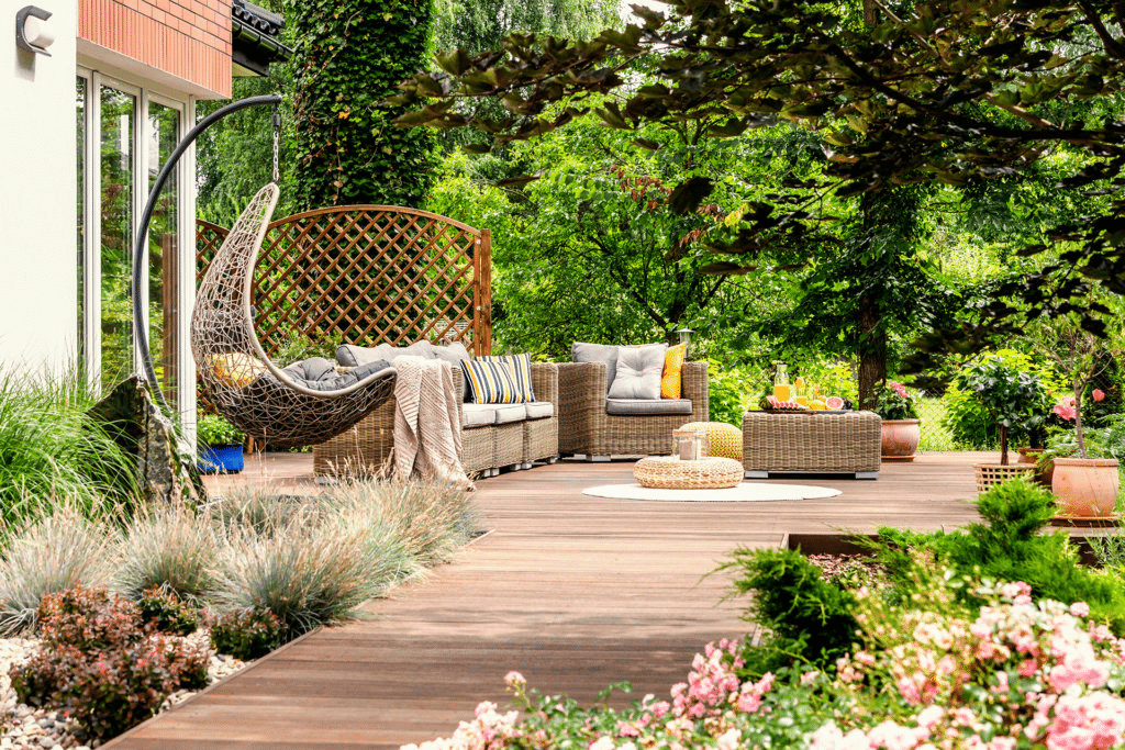 Small garden on the WPC decking, with swing chair, floor cushions