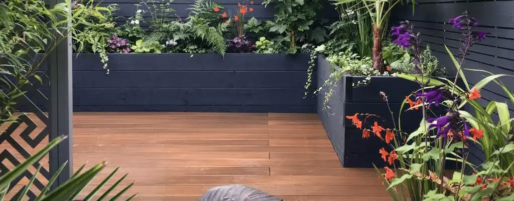 Garden with elevated flower beds constructed from WPC decking materials