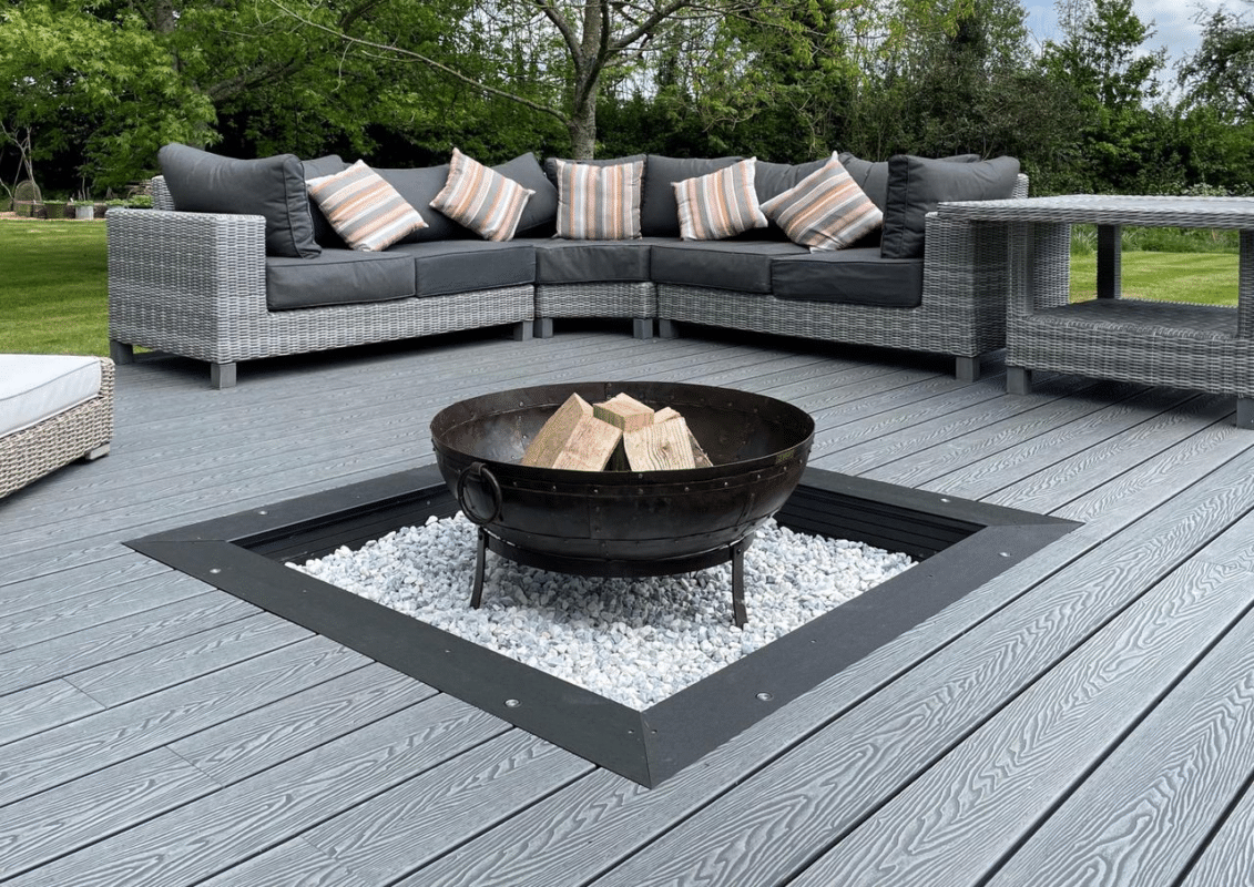Fire pit in the center of the deck, serving as a focal point and enhancing the outdoor atmosphere